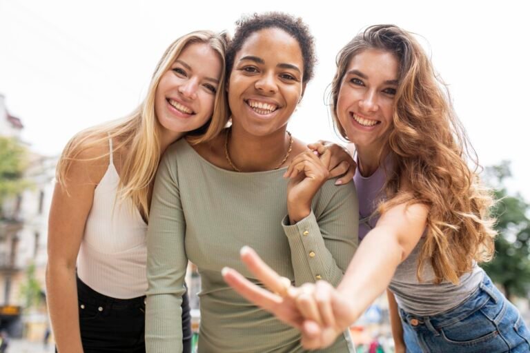 Group of 3 young women laughing